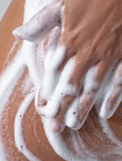 luxury foaming hand and body wash on skin, smoky cardamom scented cleanser with warm spicy notes for soft hydrated skin