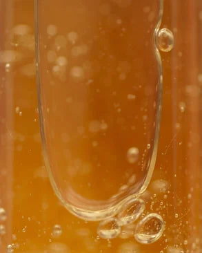 moisturising shampoo formula texture with golden bubbles, gentle hydrating shampoo for soft shiny healthy hair and daily use